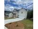 Charming two-story home with white siding, a black roof, and an attached two-car garage at 149 Silvercrest Dr, Acworth, GA 30101
