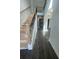 Open concept foyer showcasing wood floors, archways and modern staircase at 149 Silvercrest Dr, Acworth, GA 30101