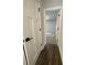 Hallway view into a bedroom, featuring white doors and trim at 149 Silvercrest Dr, Acworth, GA 30101