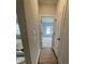 Hallway view with modern doors and a glimpse of the staircase at 149 Silvercrest Dr, Acworth, GA 30101