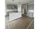 The spacious kitchen features a large island with seating and pendant lighting at 149 Silvercrest Dr, Acworth, GA 30101