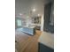 Open kitchen with an island, stainless steel appliances, and ample lighting at 149 Silvercrest Dr, Acworth, GA 30101