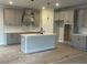 Well-lit kitchen with an island and stainless steel appliances at 149 Silvercrest Dr, Acworth, GA 30101