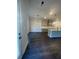 Open-concept kitchen with an island, stainless steel appliances, and gray shaker cabinets at 149 Silvercrest Dr, Acworth, GA 30101
