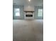 Inviting living room featuring a striking fireplace with windows on either side at 149 Silvercrest Dr, Acworth, GA 30101