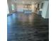Open-concept living room and kitchen with dark wood flooring and natural light at 149 Silvercrest Dr, Acworth, GA 30101