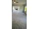 Spacious living room featuring plush carpeting, a ceiling fan, and a cozy fireplace in a neutral color palette at 149 Silvercrest Dr, Acworth, GA 30101