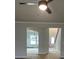 Open-concept living room with ceiling fan, and views to front entry and dining room at 149 Silvercrest Dr, Acworth, GA 30101