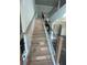 Elegant staircase featuring wood treads and modern black iron railing leading to the upper level at 149 Silvercrest Dr, Acworth, GA 30101