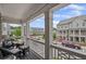 Spacious balcony with comfortable seating and a view of the street at 214 Bluestone Dr, Woodstock, GA 30188