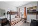 Cozy bedroom with bunk beds, window with blinds, and stylish accents at 214 Bluestone Dr, Woodstock, GA 30188