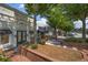 Inviting commercial district featuring manicured landscaping, brick sidewalks, and storefronts with awnings at 214 Bluestone Dr, Woodstock, GA 30188