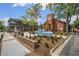 Well-maintained brick buildings with manicured landscaping, creating a professional and inviting atmosphere at 214 Bluestone Dr, Woodstock, GA 30188