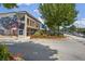 A bustling commercial intersection with vintage murals and crosswalks at 214 Bluestone Dr, Woodstock, GA 30188
