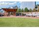 Outdoor common area with seating, lawn, and a pavilion at 214 Bluestone Dr, Woodstock, GA 30188