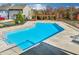 Relaxing community pool with a pergola and lounge area, offering a serene outdoor experience for residents at 214 Bluestone Dr, Woodstock, GA 30188