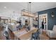 Bright dining room featuring modern fixtures, and an open floor plan to the kitchen at 214 Bluestone Dr, Woodstock, GA 30188