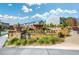 Stone sign for Bluestone Park with lush landscaping and a glimpse of the homes at 214 Bluestone Dr, Woodstock, GA 30188
