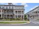 Charming two-story home featuring a welcoming front porch, brick facade, and well-manicured lawn at 214 Bluestone Dr, Woodstock, GA 30188