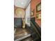 Stylish hallway featuring wood paneling, decorative art, and natural light at 214 Bluestone Dr, Woodstock, GA 30188