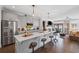 Bright and airy kitchen with stainless steel appliances, a large island and hardwood flooring at 214 Bluestone Dr, Woodstock, GA 30188