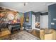 Music-themed living room featuring a piano, guitars, and unique decor at 214 Bluestone Dr, Woodstock, GA 30188