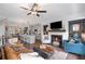 Spacious living room offers a modern fireplace, sleek TV, and comfortable seating arrangements at 214 Bluestone Dr, Woodstock, GA 30188