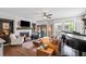 Inviting living room features a cozy fireplace, beautiful hardwood floors, and ample natural light at 214 Bluestone Dr, Woodstock, GA 30188