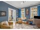 Comfortable office with two chairs, a desk, and natural light from windows at 214 Bluestone Dr, Woodstock, GA 30188