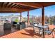 Outdoor deck with multiple tables, chairs, and a relaxing atmosphere at 214 Bluestone Dr, Woodstock, GA 30188