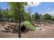 playground with climbing structures and a tunnel, providing a fun and engaging play area at 214 Bluestone Dr, Woodstock, GA 30188