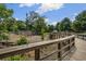Playground view featuring climbing structures and a wooden walkway, creating an adventurous space for children at 214 Bluestone Dr, Woodstock, GA 30188