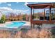 Community pool area featuring a pool, seating area, and views of the surrounding landscape at 214 Bluestone Dr, Woodstock, GA 30188