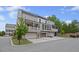 Back view of the townhome featuring balconies and garages at 214 Bluestone Dr, Woodstock, GA 30188