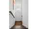 Staircase with wood stairs and handrail, providing access to upper or lower levels at 214 Bluestone Dr, Woodstock, GA 30188