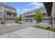 Street view of the townhomes with garages and balconies at 214 Bluestone Dr, Woodstock, GA 30188