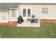 Outdoor patio with a dining set, ideal for entertaining in the backyard at 3984 Potomac Walk Ct, Loganville, GA 30052
