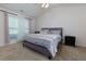 Cozy bedroom featuring a comfortable bed, ceiling fan and natural light at 3984 Potomac Walk Ct, Loganville, GA 30052