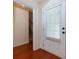 Bright entryway with hardwood floors leading to stairs, next to the front door at 3984 Potomac Walk Ct, Loganville, GA 30052