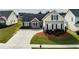 A well-maintained home featuring a spacious driveway and lush landscaping, offering suburban comfort at 3984 Potomac Walk Ct, Loganville, GA 30052