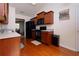Updated kitchen features wood cabinets, modern appliances, and hardwood flooring at 3984 Potomac Walk Ct, Loganville, GA 30052