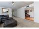 Open concept living room with plush carpeting and an adjacent kitchen at 3984 Potomac Walk Ct, Loganville, GA 30052