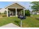 Community grill area with covered picnic tables for outdoor cooking and gatherings at 3984 Potomac Walk Ct, Loganville, GA 30052
