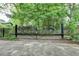 Black metal gate entrance to a lush and private backyard oasis, providing privacy and security at 799 Monroe Ne Dr, Atlanta, GA 30308