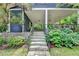 Backyard view of steps leading up to a covered porch at 799 Monroe Ne Dr, Atlanta, GA 30308