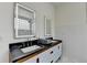 Bathroom showcasing double vanity with sleek mirrors and stylish subway tile at 799 Monroe Ne Dr, Atlanta, GA 30308