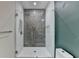 Modern shower with glass door and decorative tile at 799 Monroe Ne Dr, Atlanta, GA 30308
