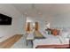 Bright bedroom with a ceiling fan, a sitting area by the bed, and hardwood floors at 799 Monroe Ne Dr, Atlanta, GA 30308