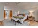 Bright bedroom with a ceiling fan, a sitting area by the bed, and hardwood floors at 799 Monroe Ne Dr, Atlanta, GA 30308