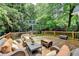 Expansive wooden deck featuring comfortable seating and lush green surroundings for outdoor enjoyment at 799 Monroe Ne Dr, Atlanta, GA 30308